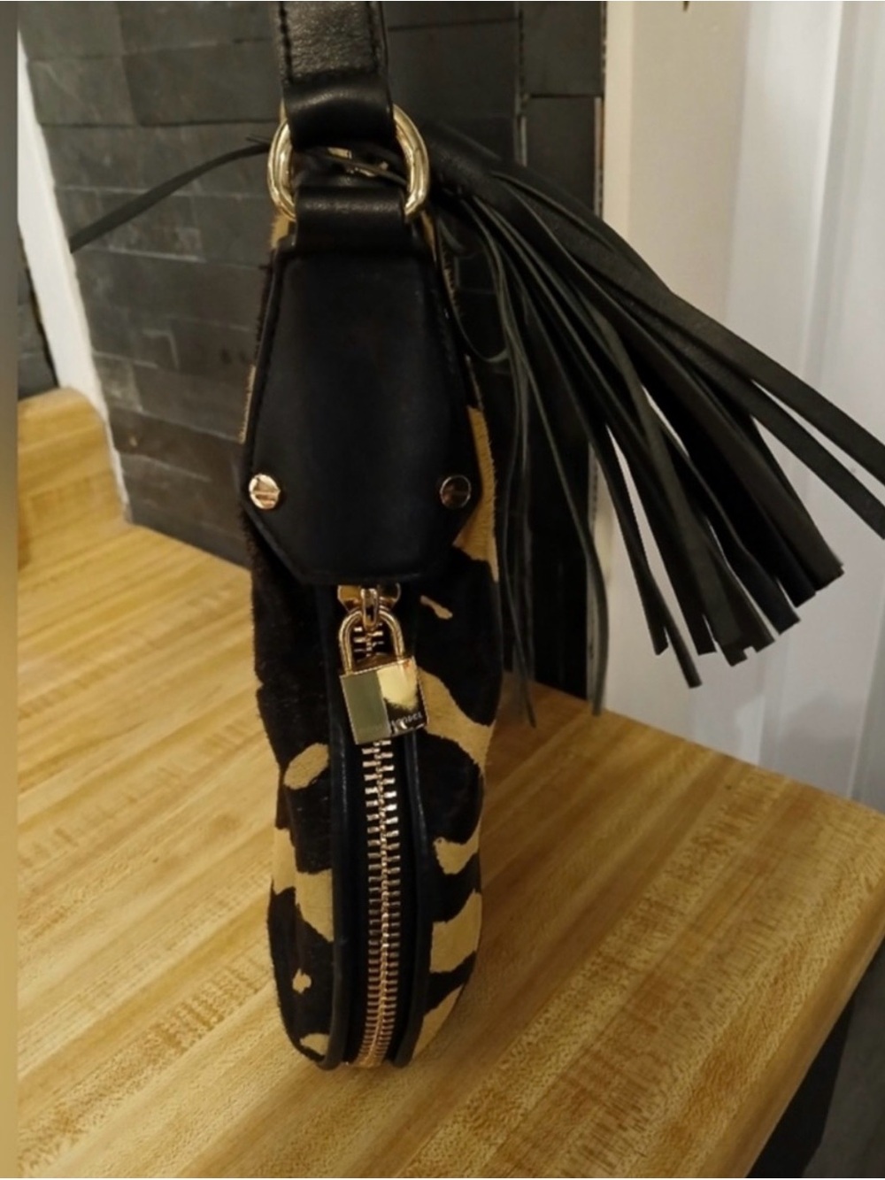 Henri Bendel- Black and Tan Animal-Print Calf Hair Shoulder Bag with Tassel - Picture 3 of 7